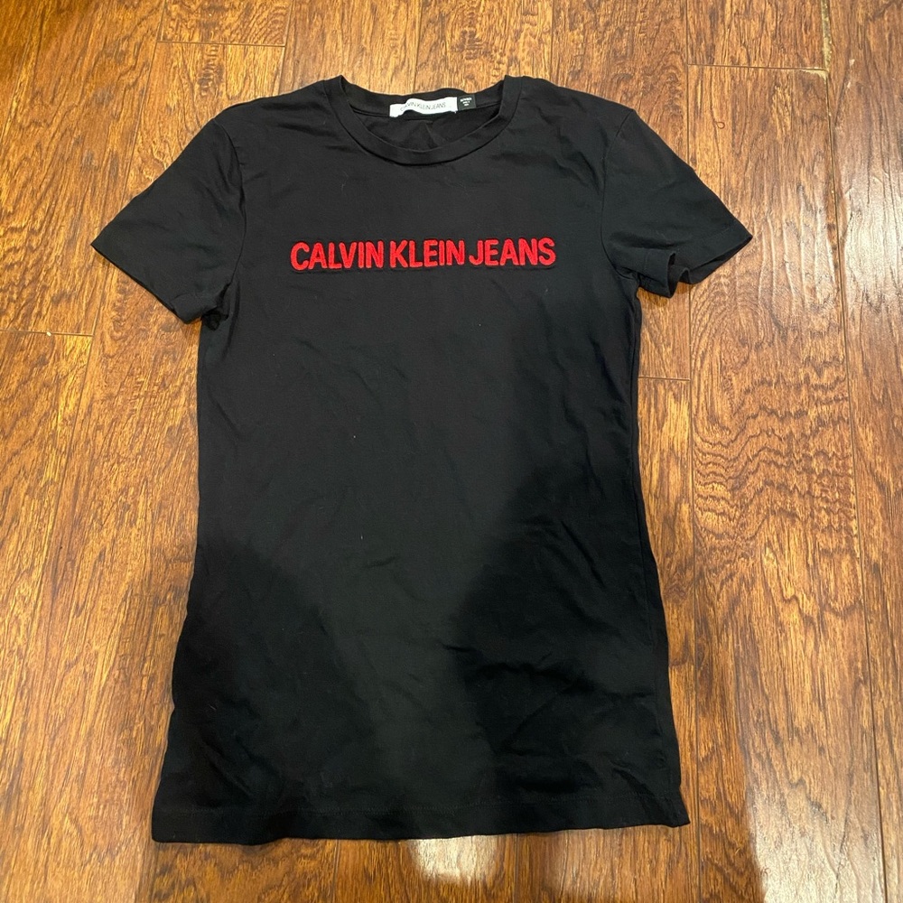 Calvin Klein black T-shirt with red logo.